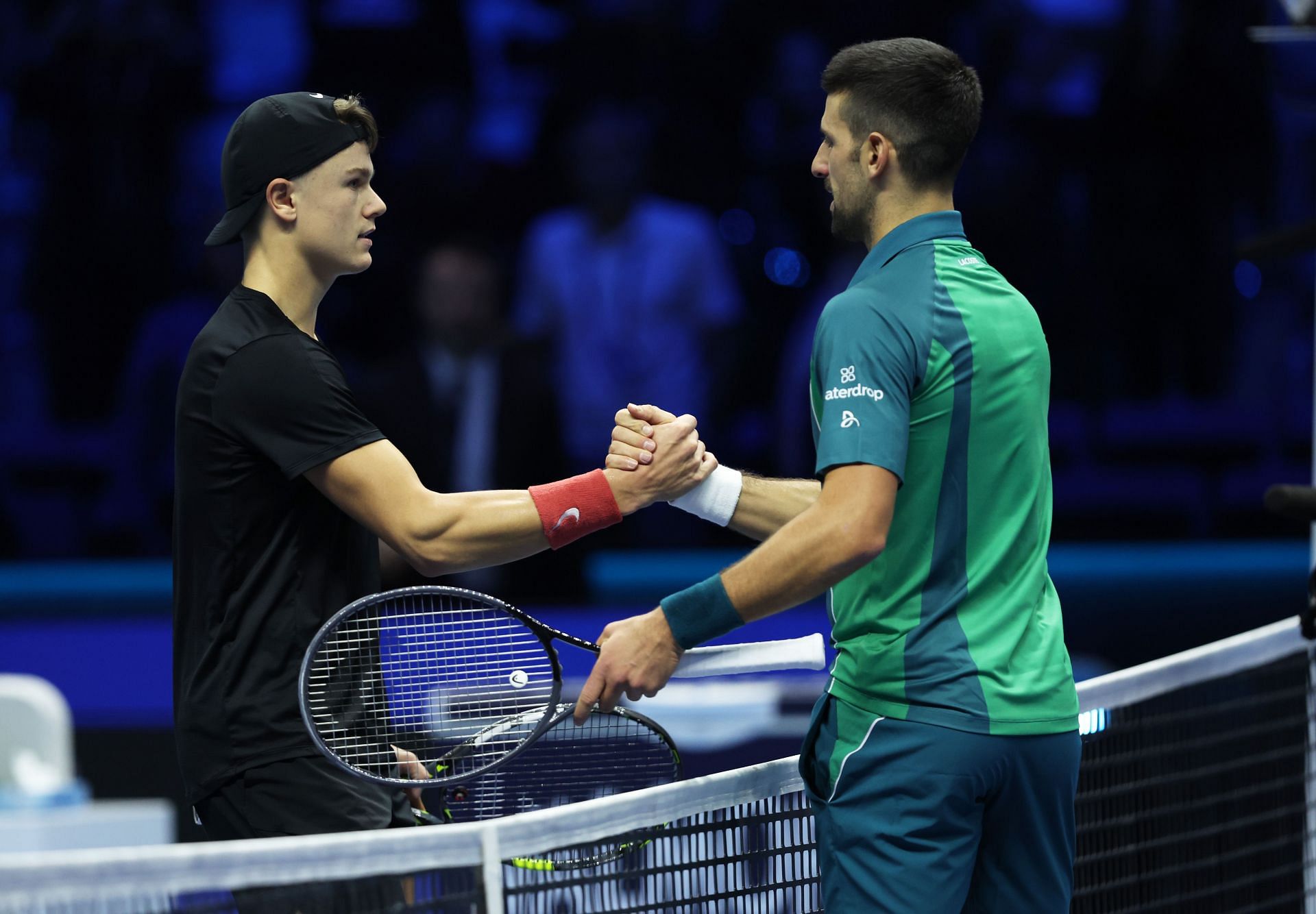 Holger Rune greets Novak Djokovic after their 2024 ATP Finals match