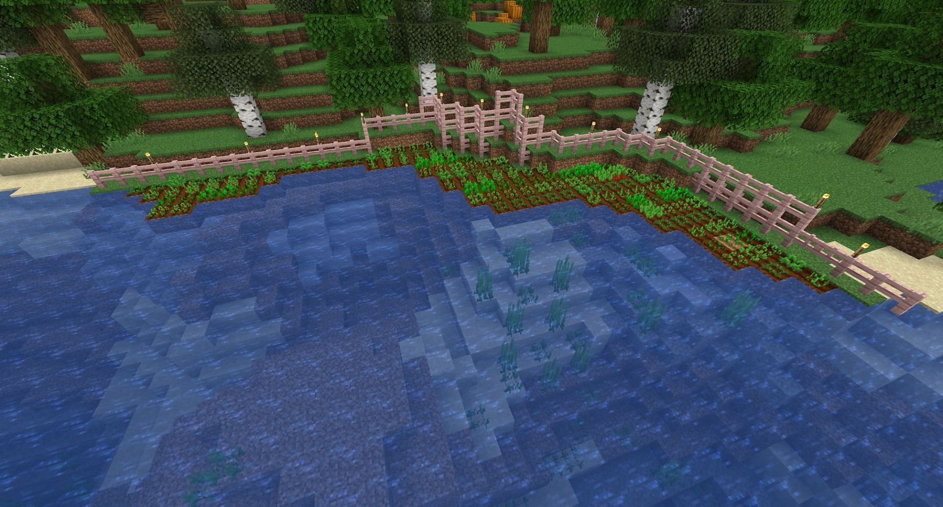 An example of a farm build along a flowing river (Image via Mojang)