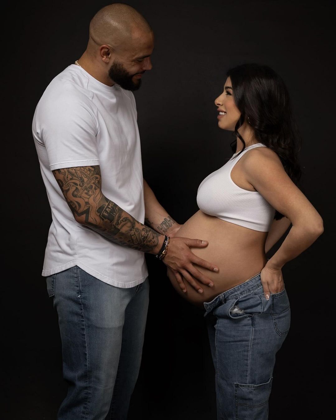Dak Prescott with Ramos holding her and the baby bump