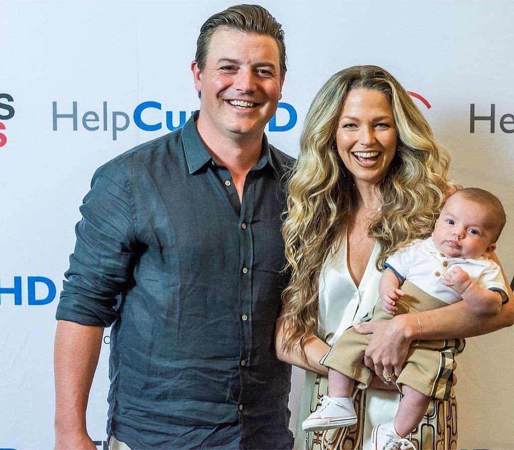 Joe Smith (L) with his wife Allie and son Jacob