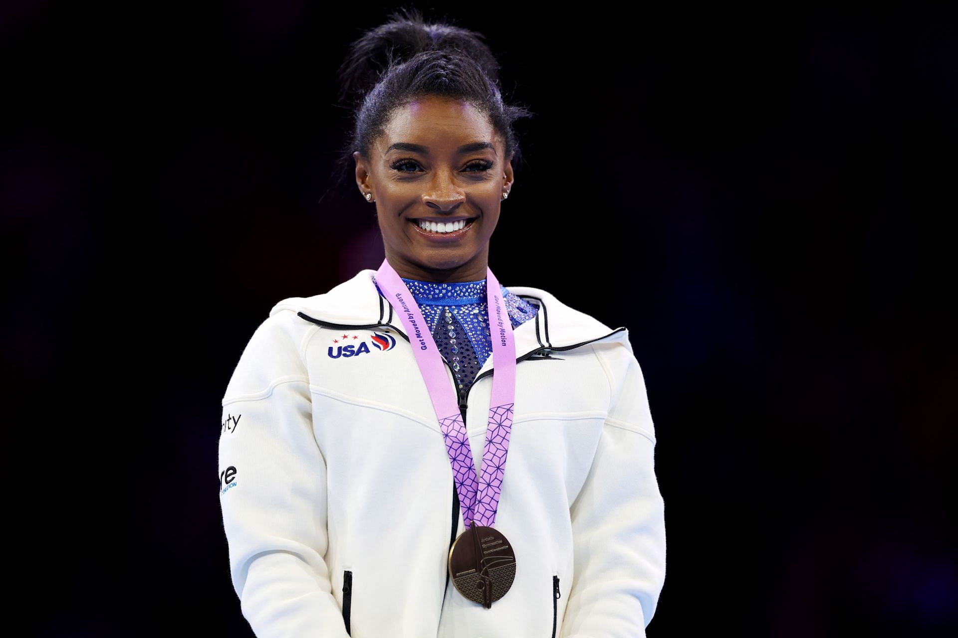 Simone Biles reacts during the medal ceremony for the Women&#039;s All-Around Final at the 2023 Artistic Gymnastics World Championships at Antwerp Sportpaleis in Belgium.