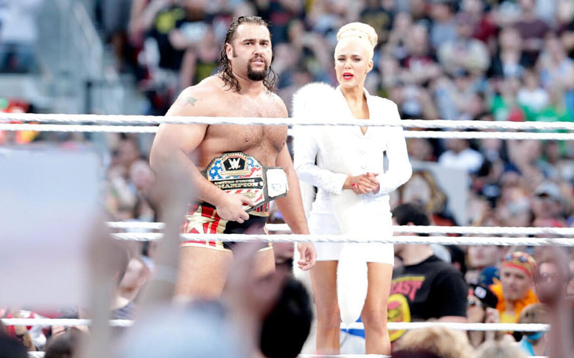Rusev and Lana in the ring awaiting John Cena at WrestleMania 31.