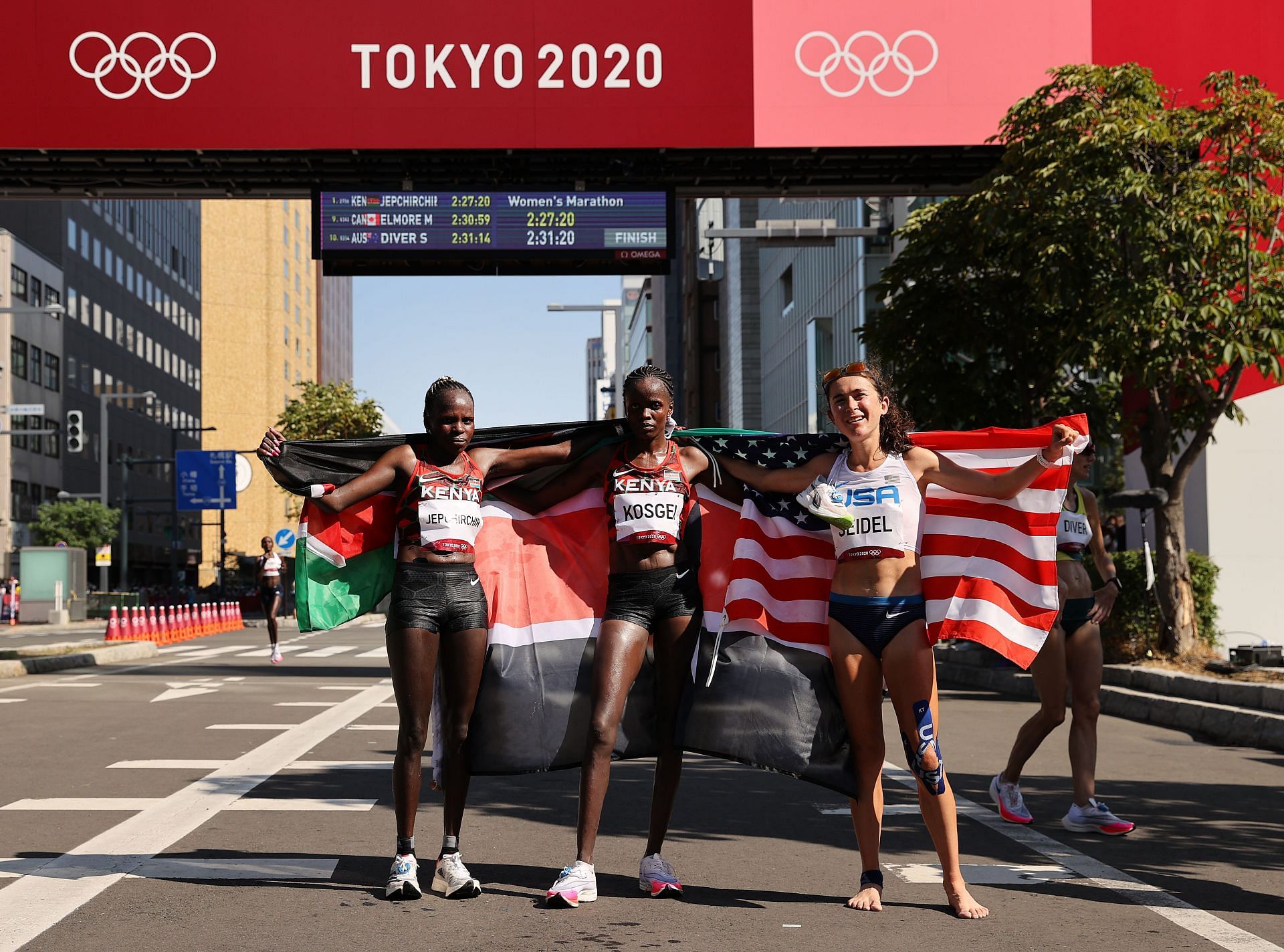 Peres Jepchirchir (middle), Brigid Kosgei (left) and Molly Seidel (right) after the Women&#039;s Marathon Final at the Tokyo 2020 Olympic Games. (Photo by Clive Brunskill/Getty Images)