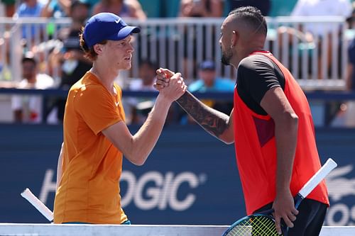 Nick Kyrgios and Jannik Sinner interact after a match in 2022