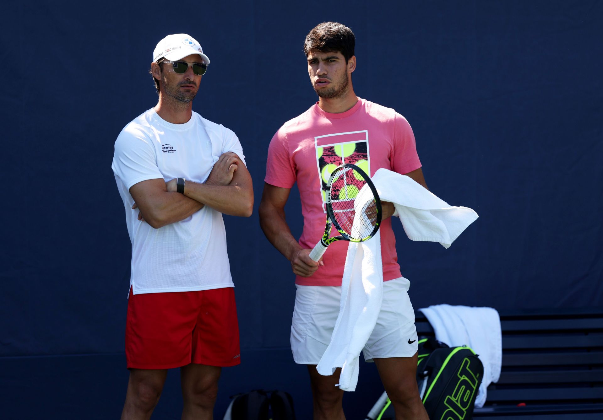 Juan Carlos Ferrero (L) and Carlos Alcaraz