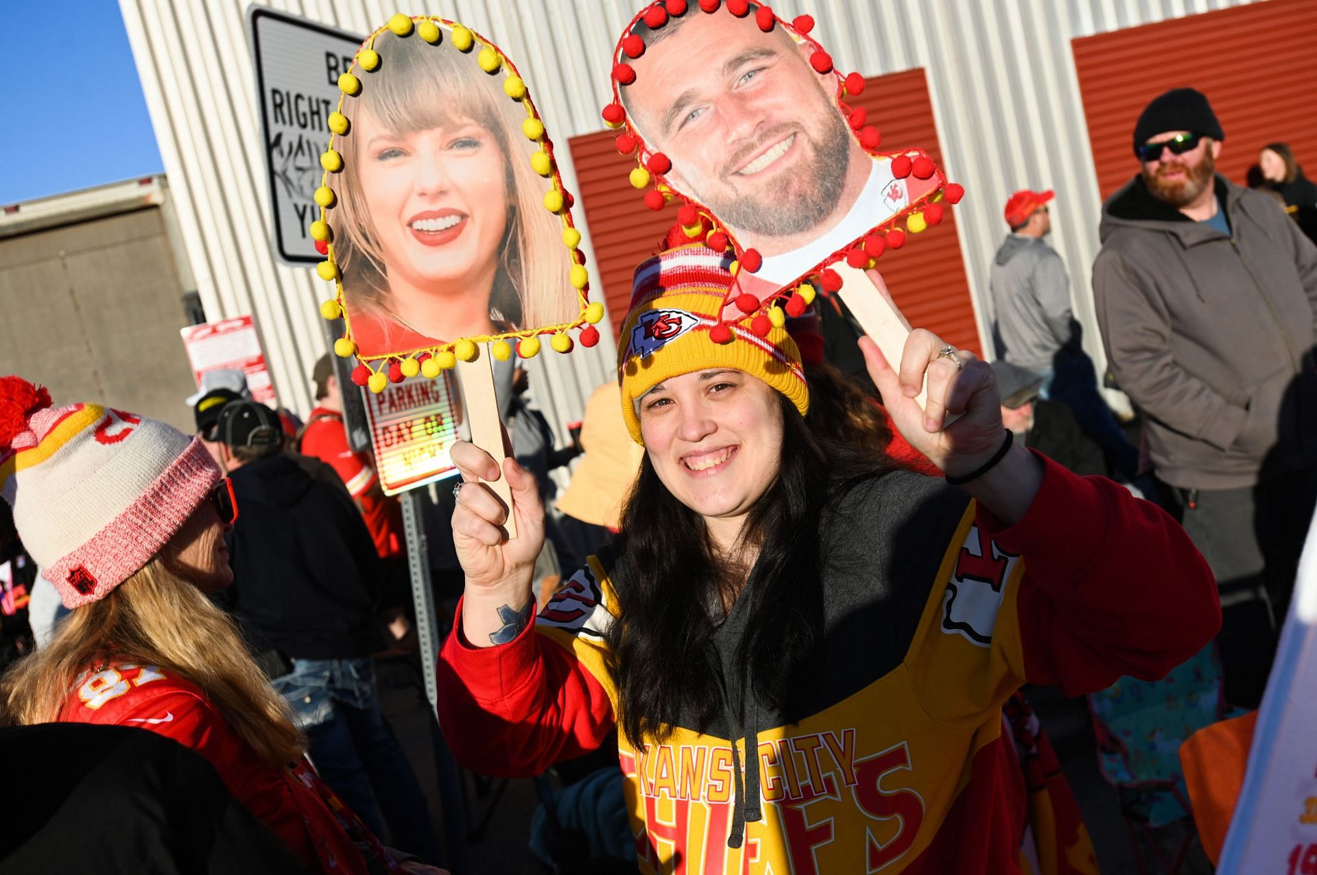 Fans with Taylor Swift signs at the Chiefs&#039; Super Bowl parade