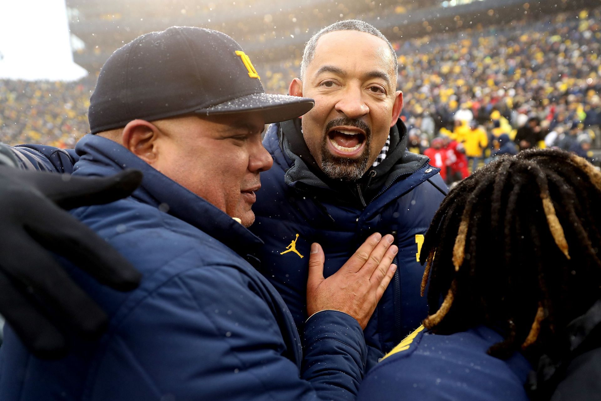 Michigan athletic director Warde Manual, shown here celebrating a UM football win with basketball coach Juwan Howard, became the CFP chairman on Thursday.