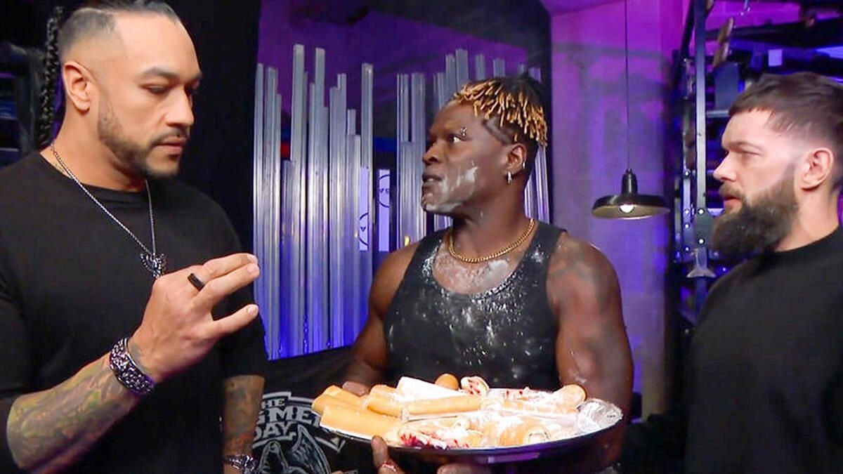 R-Truth in a backstage segment wit The Judgment Day.