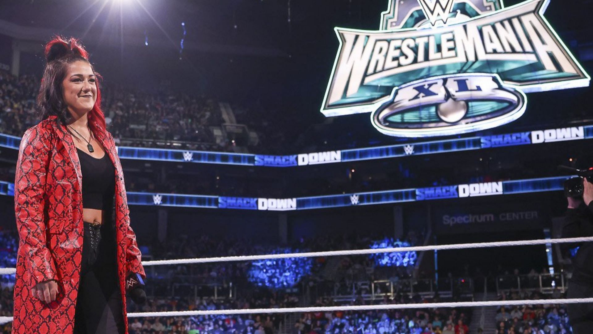 Bayley looks on during WWE SmackDown with the WrestleMania 40 logo