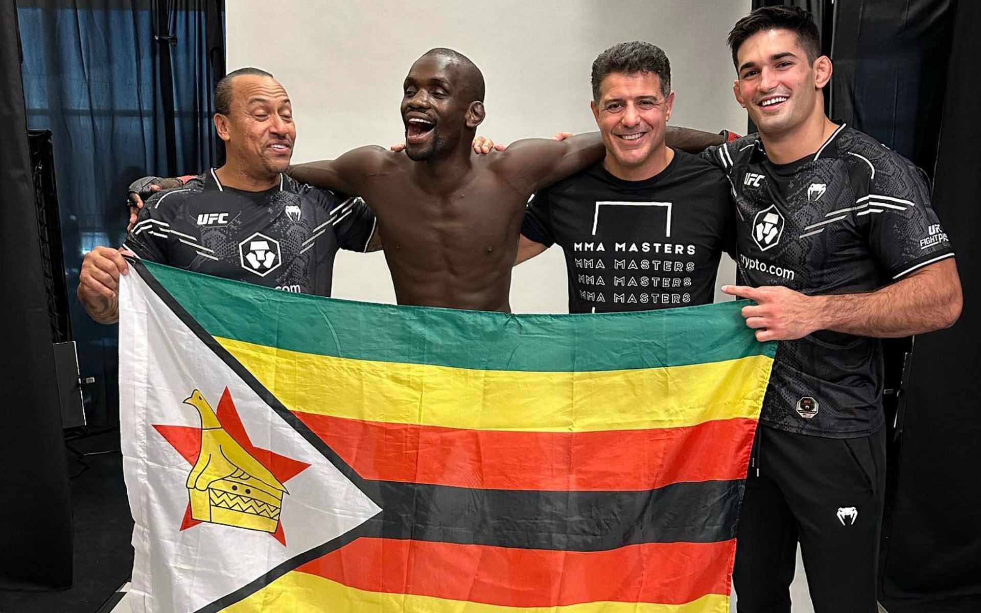 Themba Gorimbo (center) celebrates his UFC Vegas 85 victory with his team [Photo Courtesy @thembagorimbo_mma on Instagram]