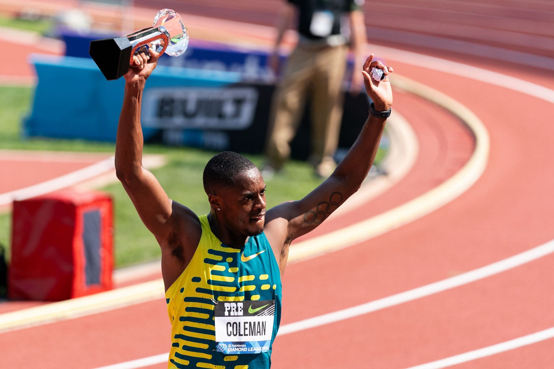 Christian Coleman holds up the Diamond League Final trophy after winning the the Men&#039;s 100m at Hayward Field on September 16, 2023 in Eugene, Oregon. (Photo by Ali Gradischer/Getty Images)