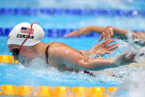 Claire Curzan competes in the Women's 100m Butterfly' heats at the Tokyo 2020 Olympic Games. (Photo by Al Bello/Getty Images)