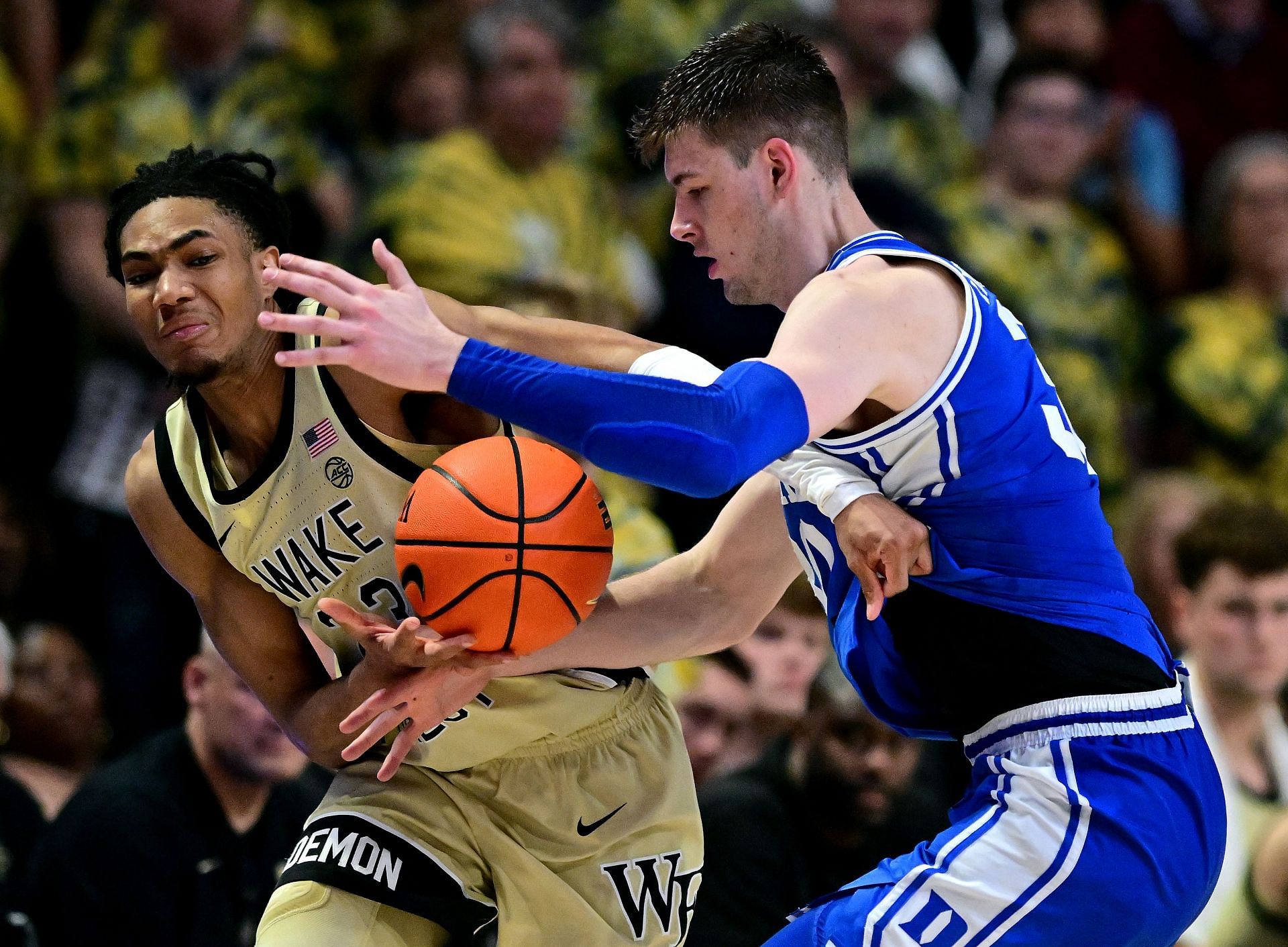 Hunter Sallis #23 of the Wake Forest Demon Deacons battles Kyle Filipowski #30 of the Duke Blue Devils for the ball during the second half of the game at Lawrence Joel Veterans Memorial Coliseum on February 24, 2024 in Winston Salem, North Carolina.