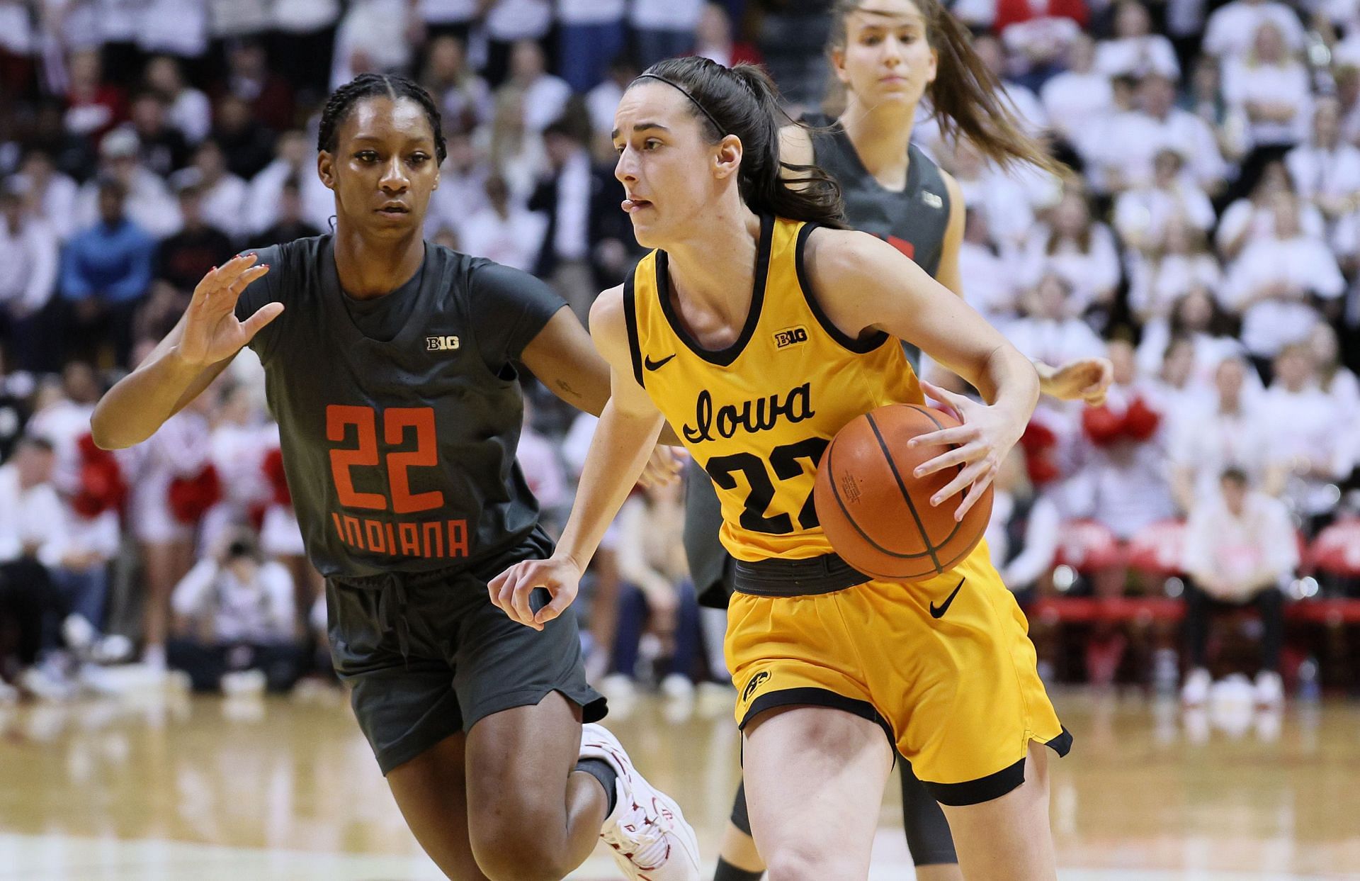 Caitlin Clark #22 of the Iowa Hawkeyes dribbles the ball in the first half against the Indiana Hoosiers at Simon Skjodt Assembly Hall.