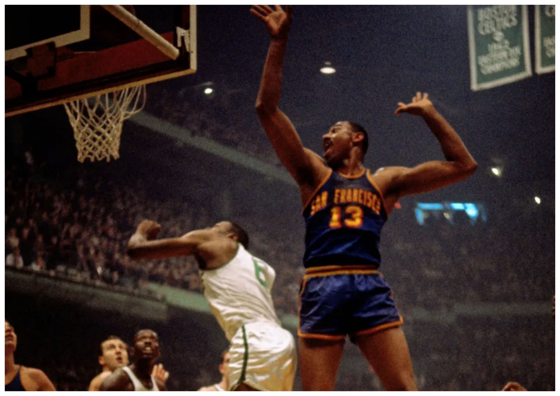 Wilt Chamberlain (right) holds the record for most points scored with 100 (Photo credit: Dick Raphael/NBAE via Getty Images)
