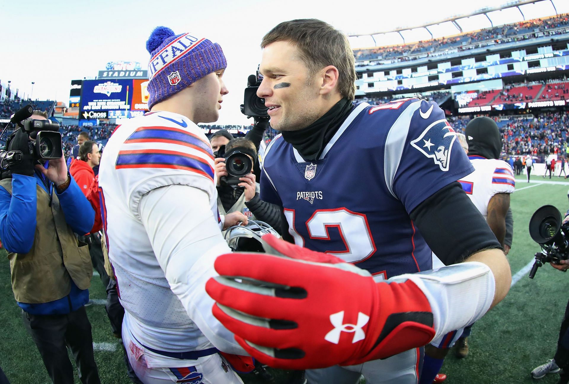 Josh Allen (l) with the Bills and Brady (r) with the Patriots