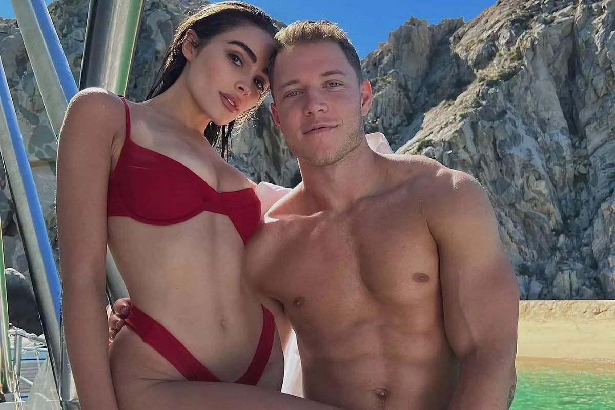 Olivia Culpo (L) and Christian McCaffrey