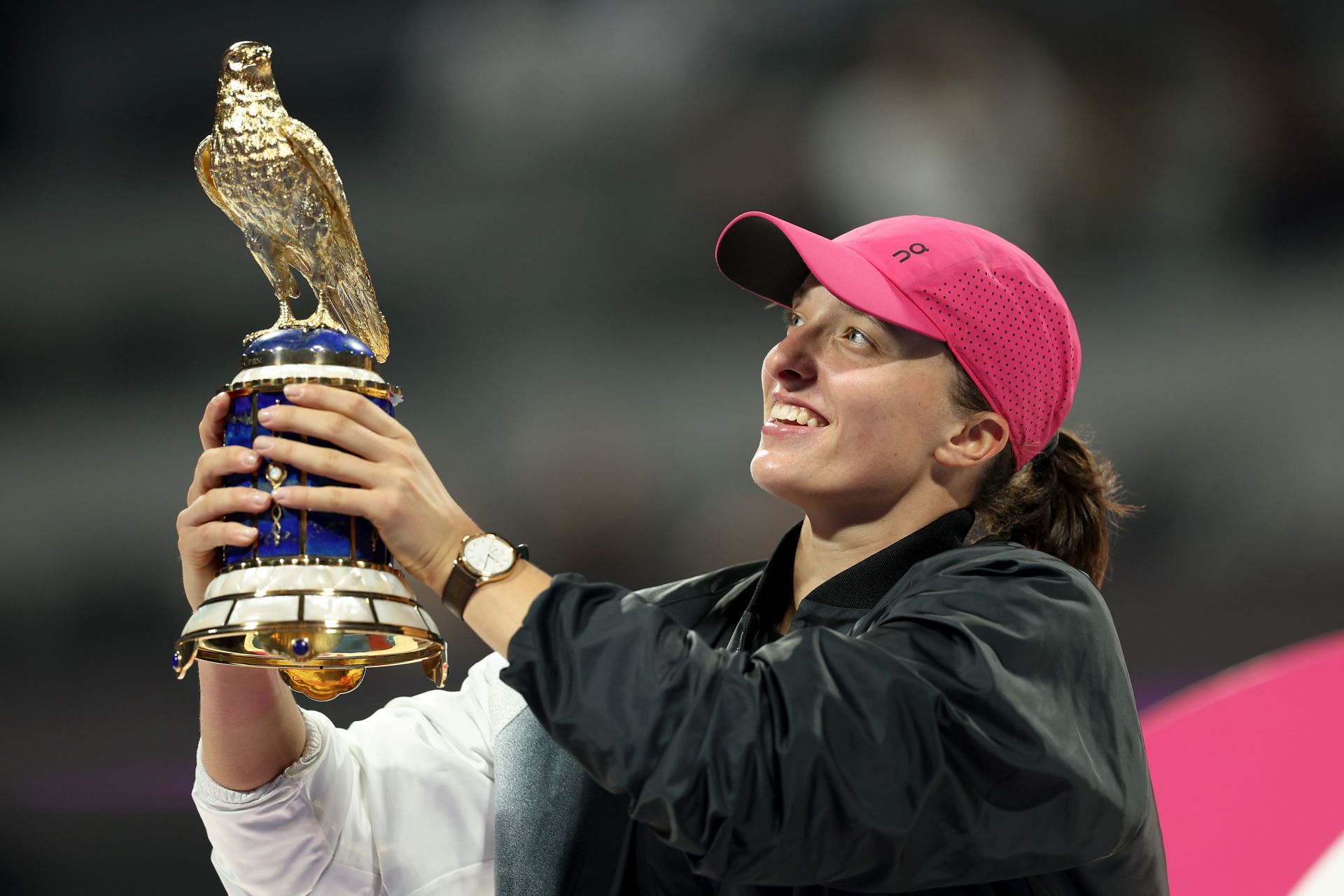 Iga Swiatek pictured with her 2024 Qatar Open trophy