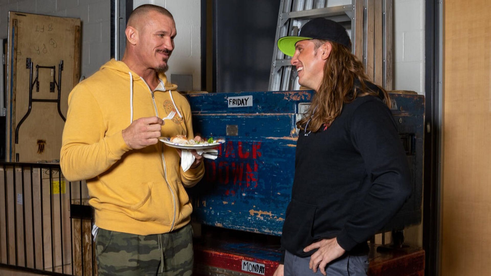 Randy Orton and Matt Riddle sharing a candid backstage moment.