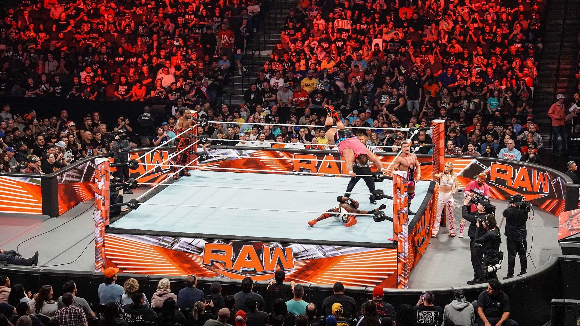 The WWE Universe watches in-ring RAW action from a packed arena