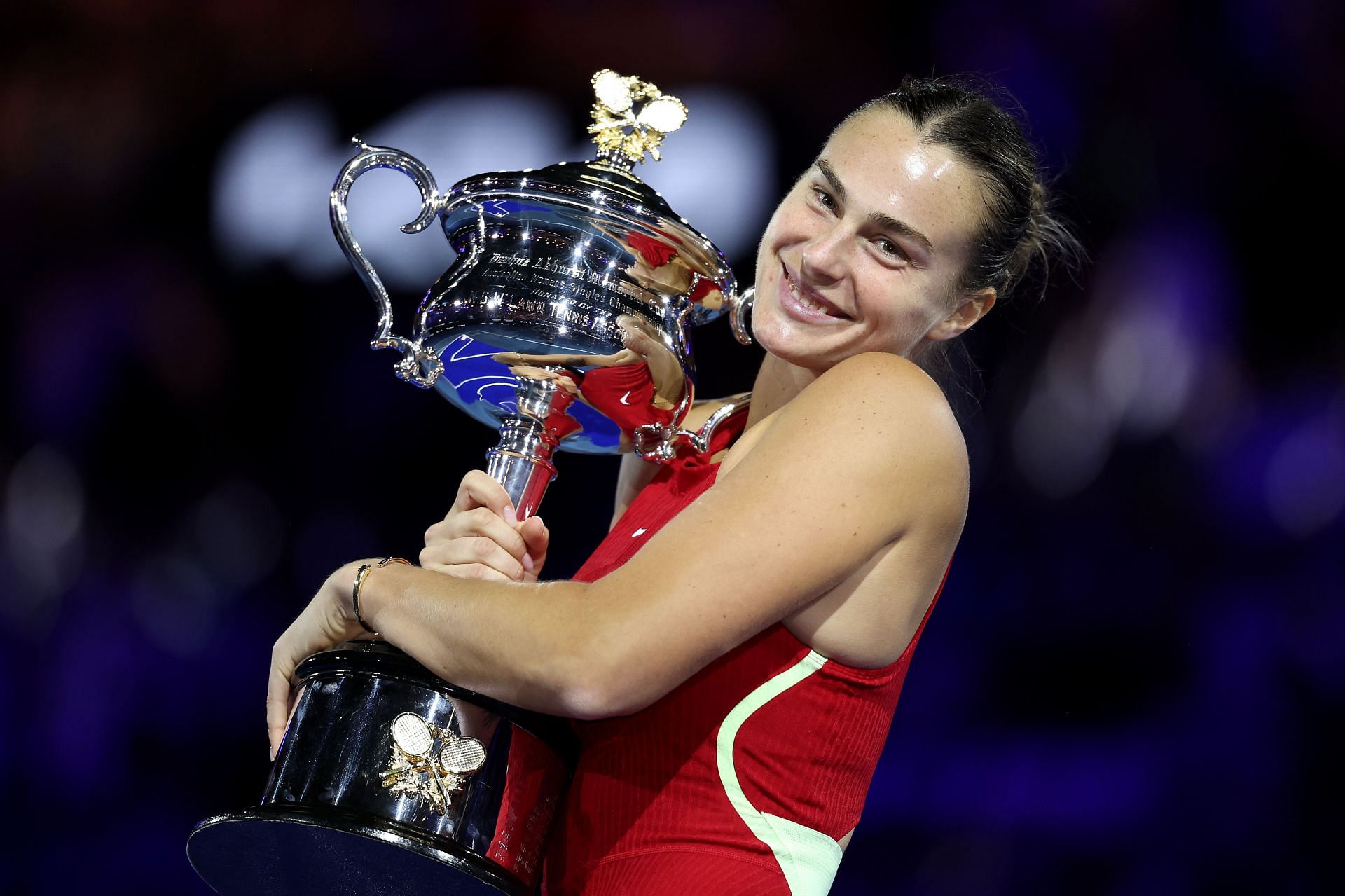Aryna Sabalenka with the Australian Open trophy after winning the title for the second time in 2024