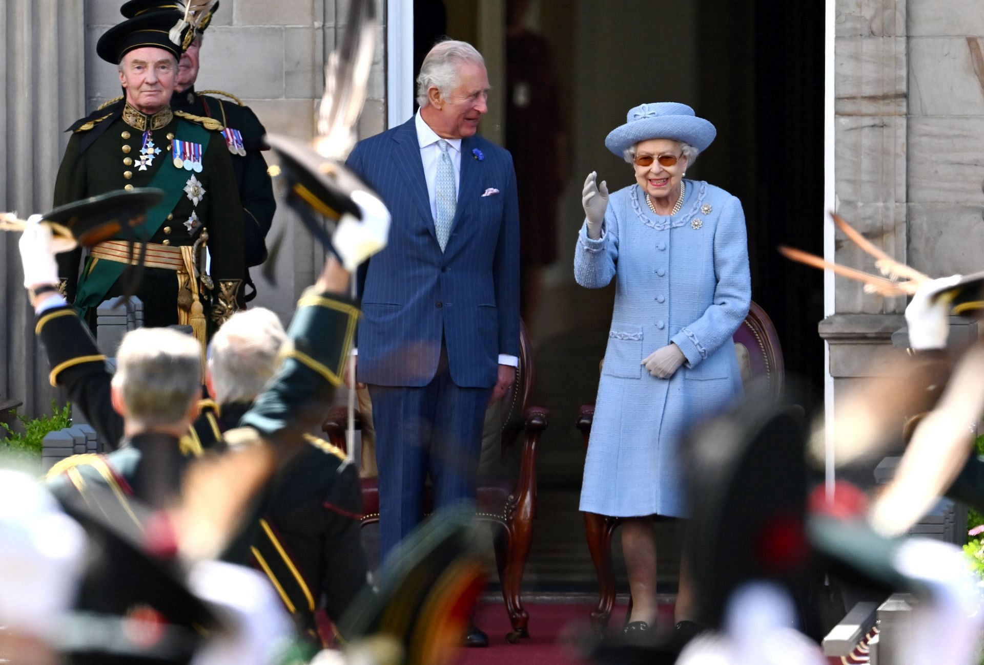 King Charles and Queen Elizebeth in the gardens of the Palace of Holyroodhouse (Image via Getty)