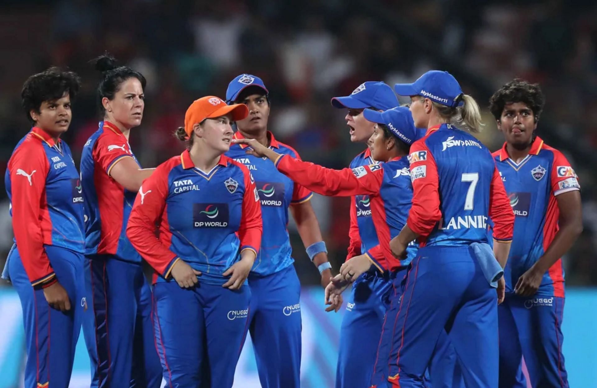 DC players celebrating the fall of a wicket vs RCB. (Image: wplt20.com)