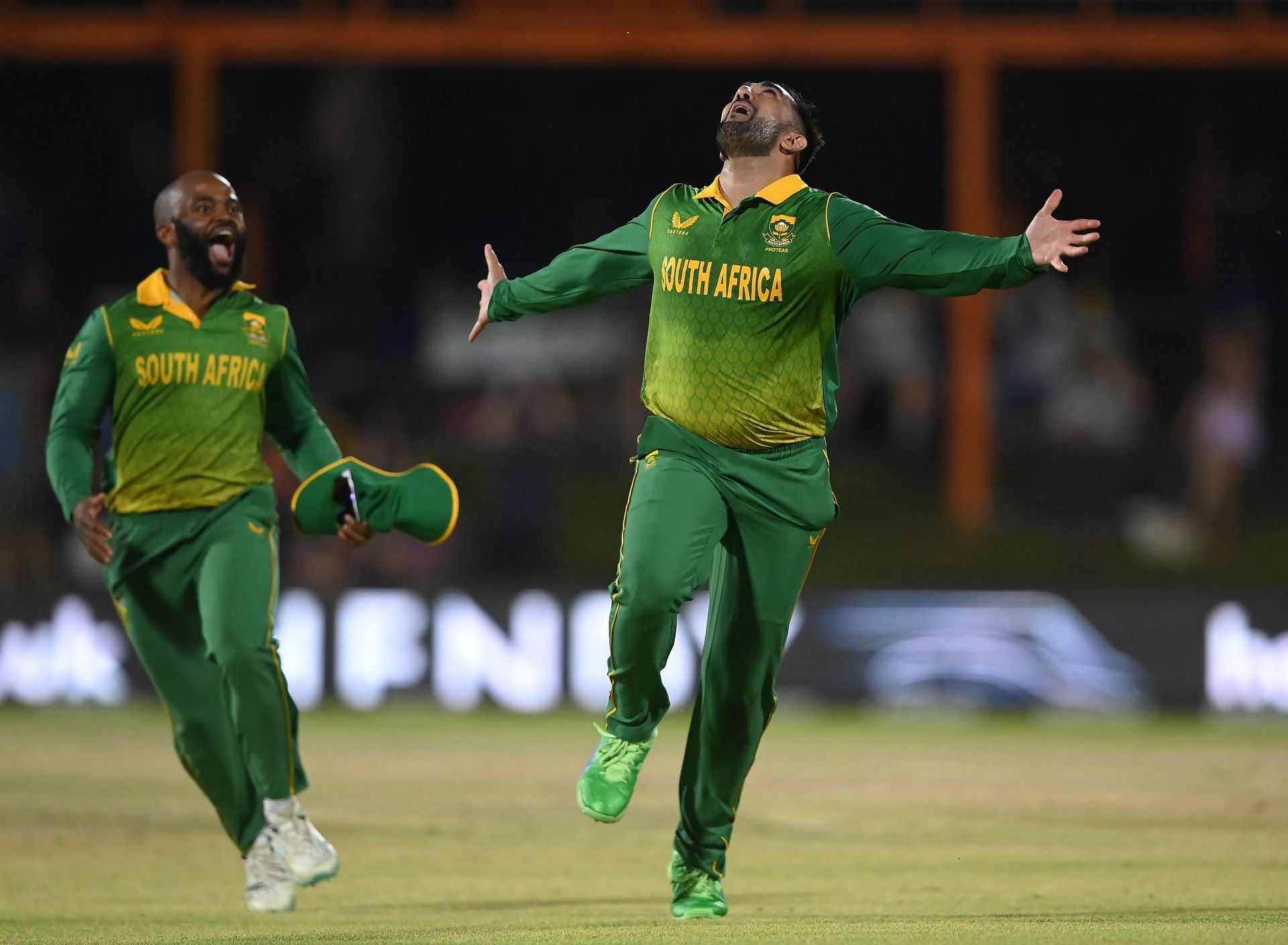 Tabraiz Shamsi (right) celebrating a wicket with captain Temba Bavuma (left).
