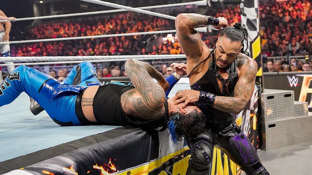 Damian Priest prepares to smash Jey Uso in a tag team match on WWE RAW