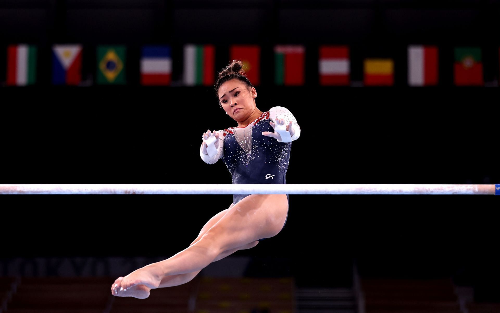 Suni Lee of Team United States competes on uneven bars during the Women&#039;s All-Around Final at the 2020 Olympic Games.