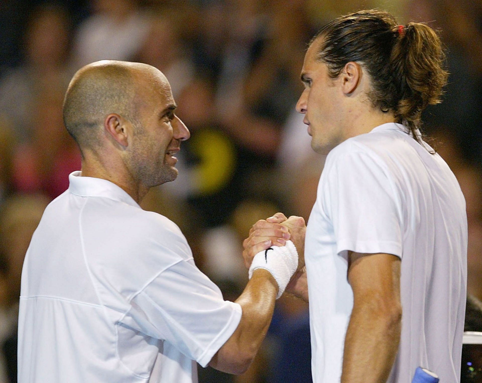 Agassi and Haas after a match in 2004