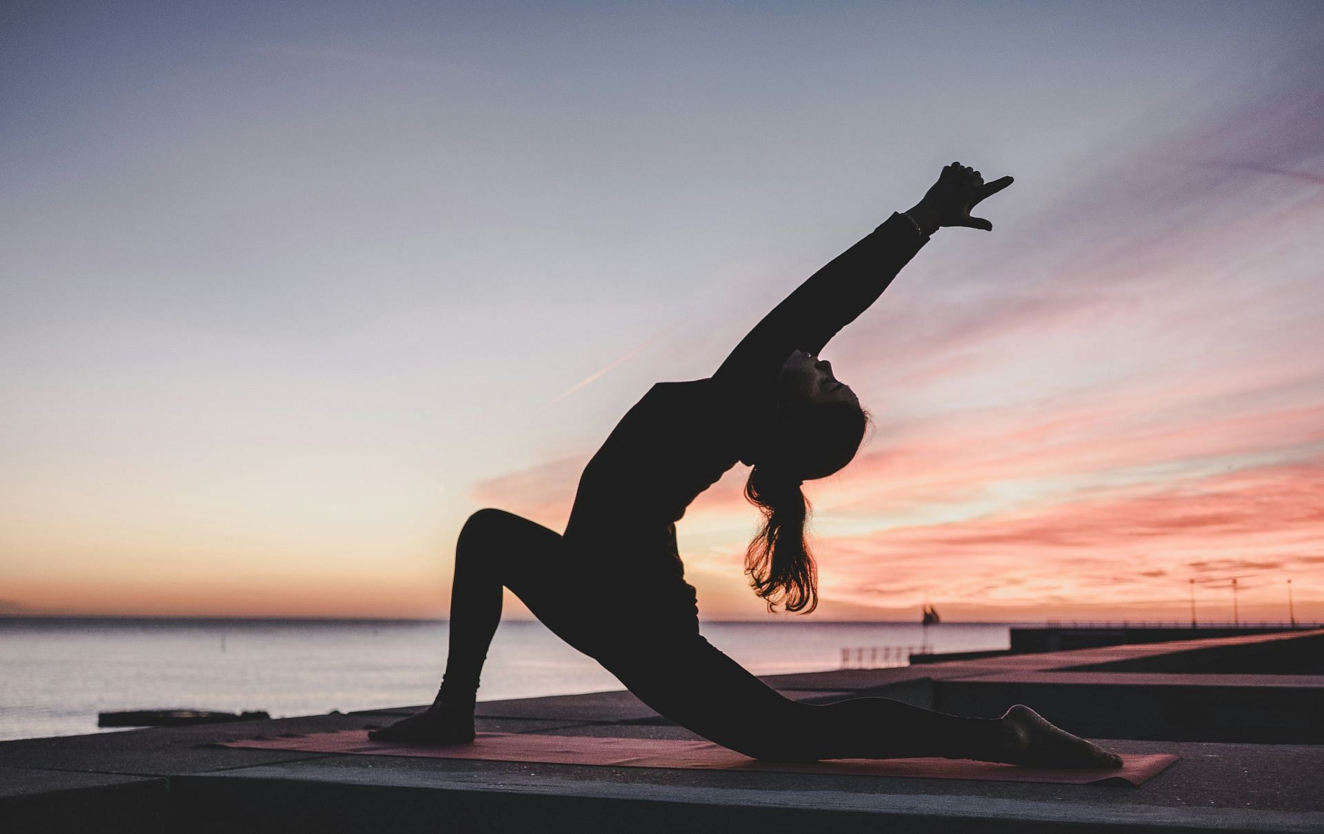 One of the stress-busting yoga poses: Sun salutation (Image by Kike Vega/Unsplash)