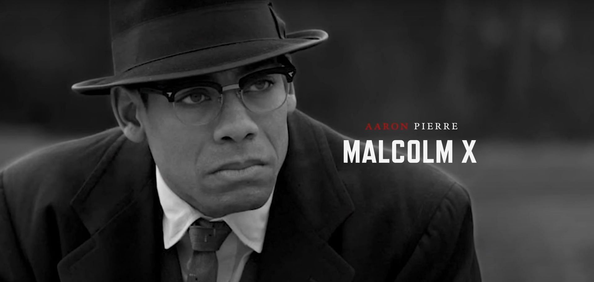Aaron Pierre as Malcolm X (Image via National Geographic, Genius: MLK/X, 1:42)