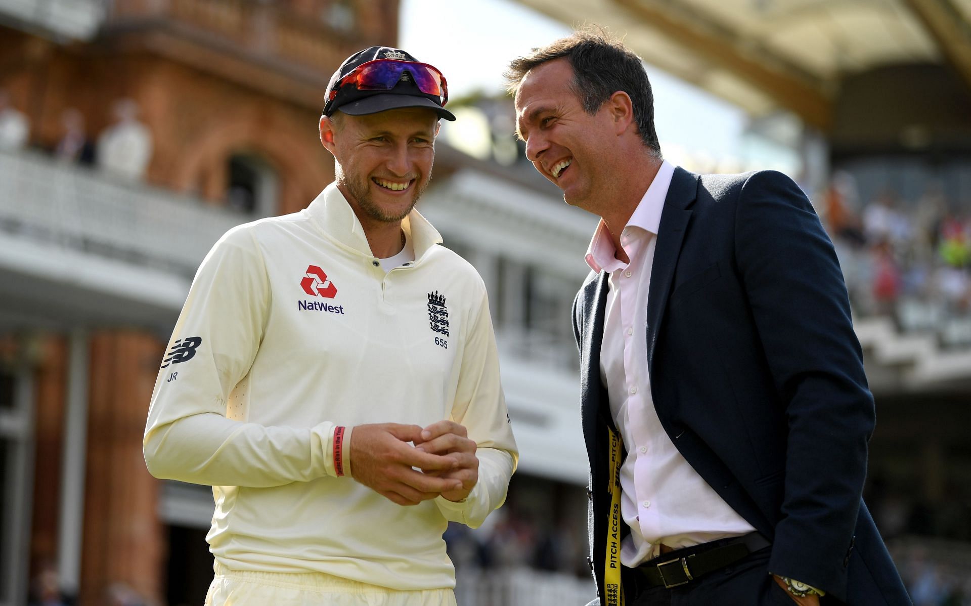 Joe Root (right) speaks with Michael Vaughan. (Pic: Getty Images)