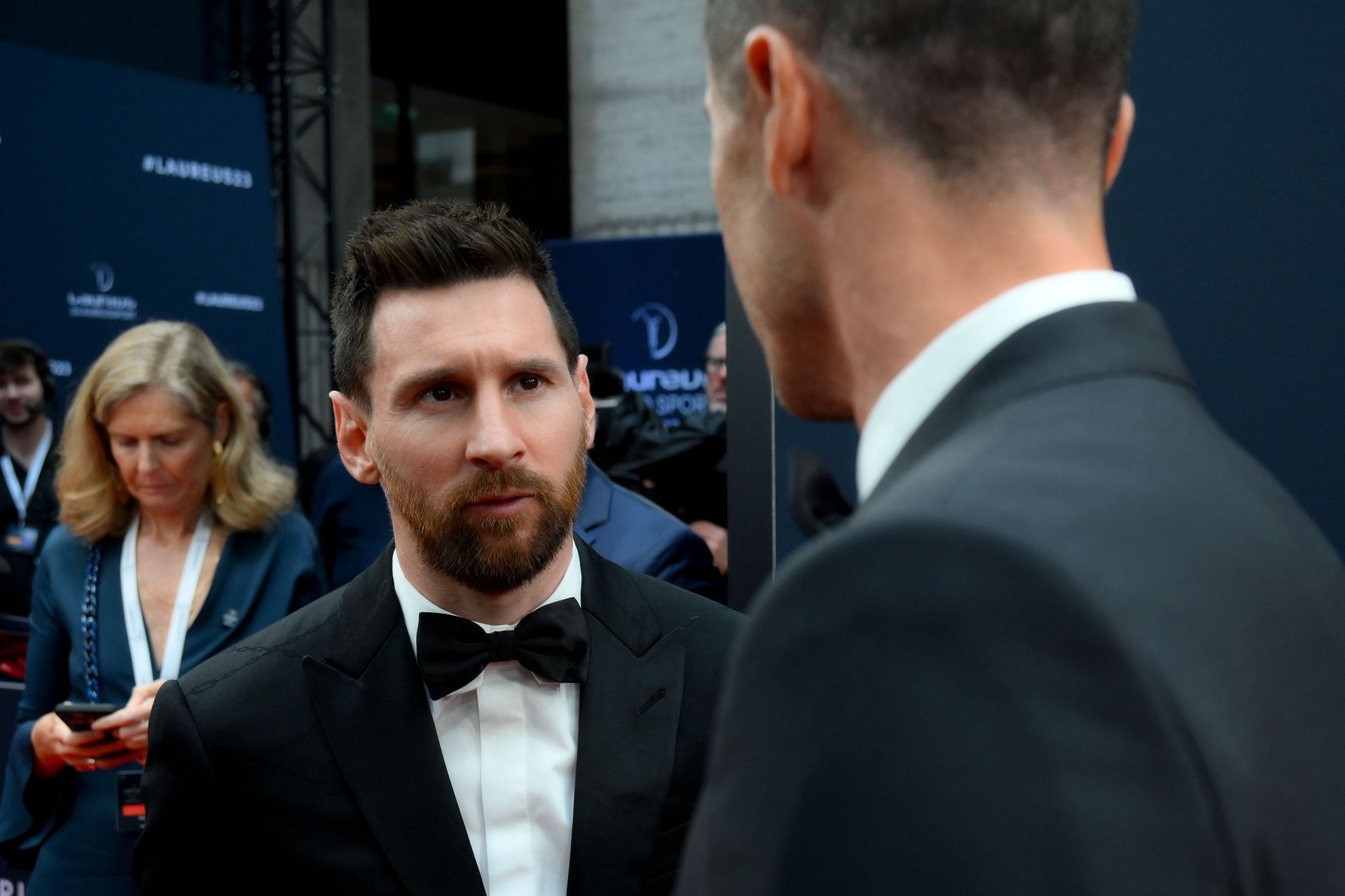 Lionel Messi (facing) and Robert Lewandowski