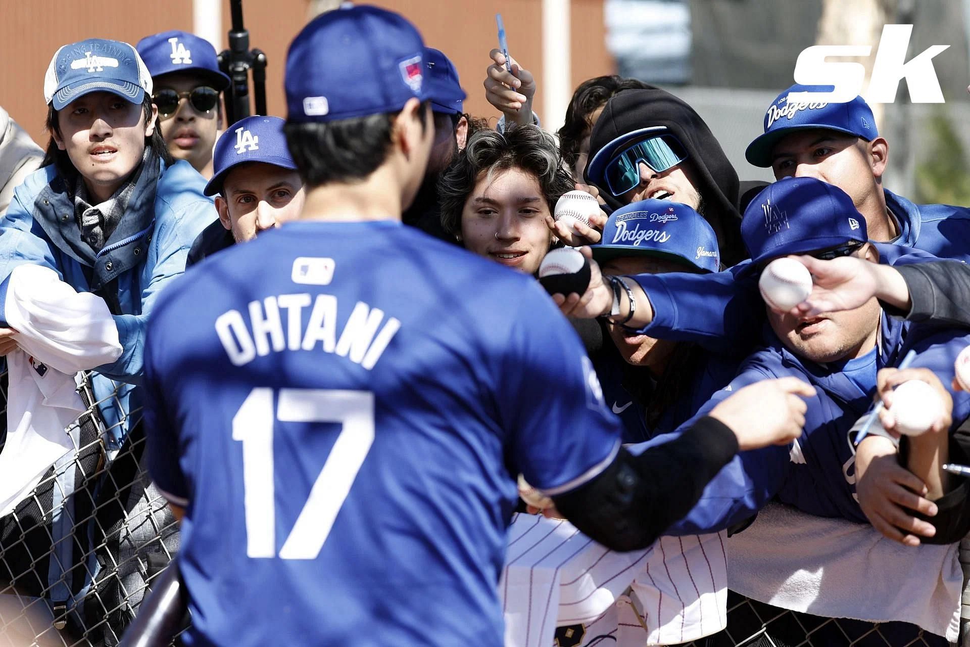 Shohei Ohtani signing merchandise for fans