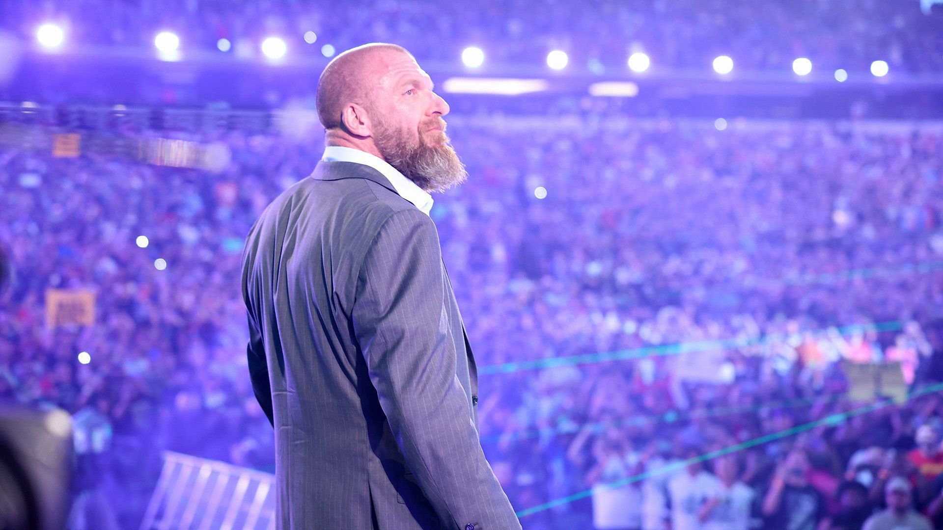 WWE Chief Content Officer Triple H looks at the WrestleMania crowd