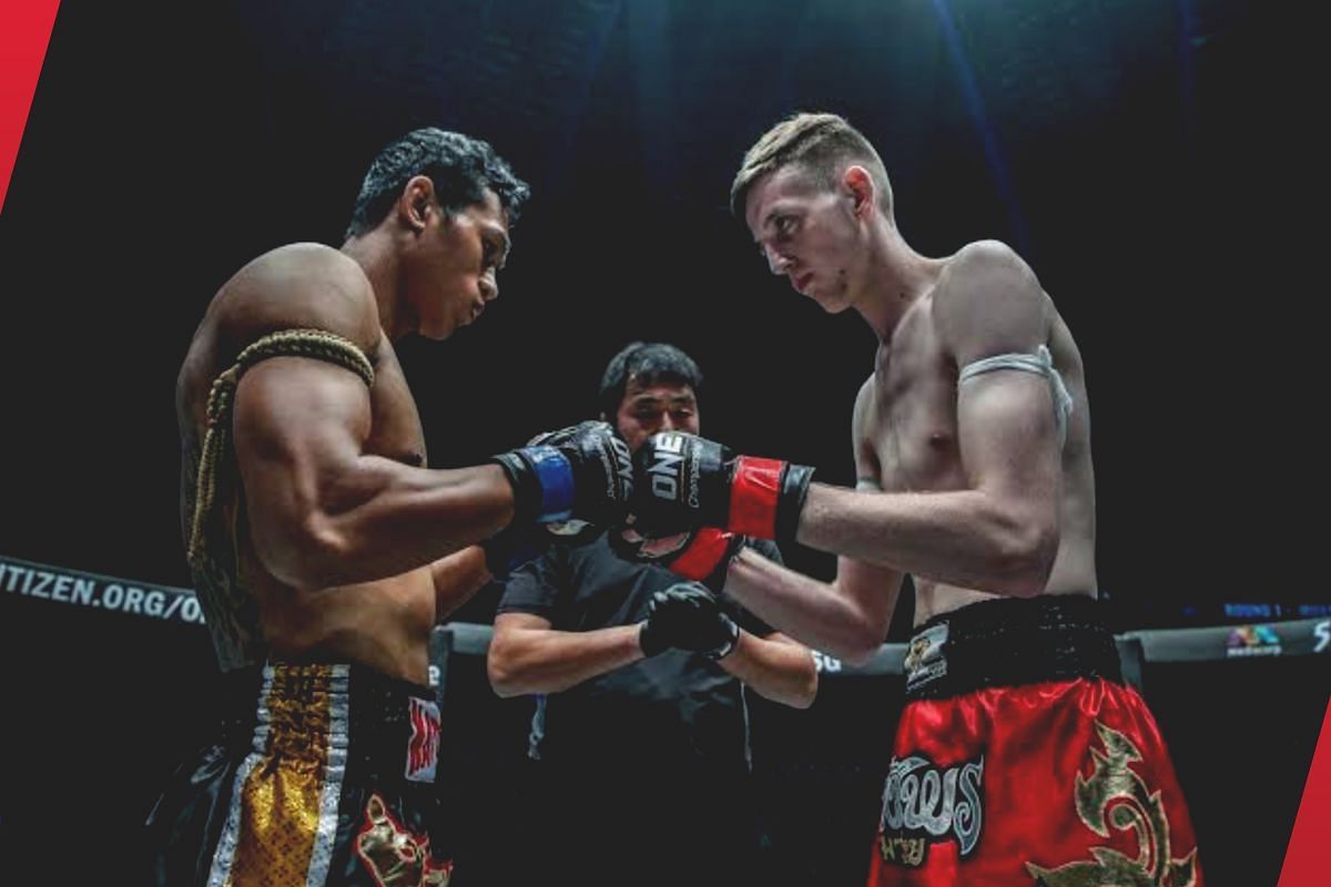 Jo Nattawut (left) touching gloves with George Mann (right) [Photo via: ONE Championship]