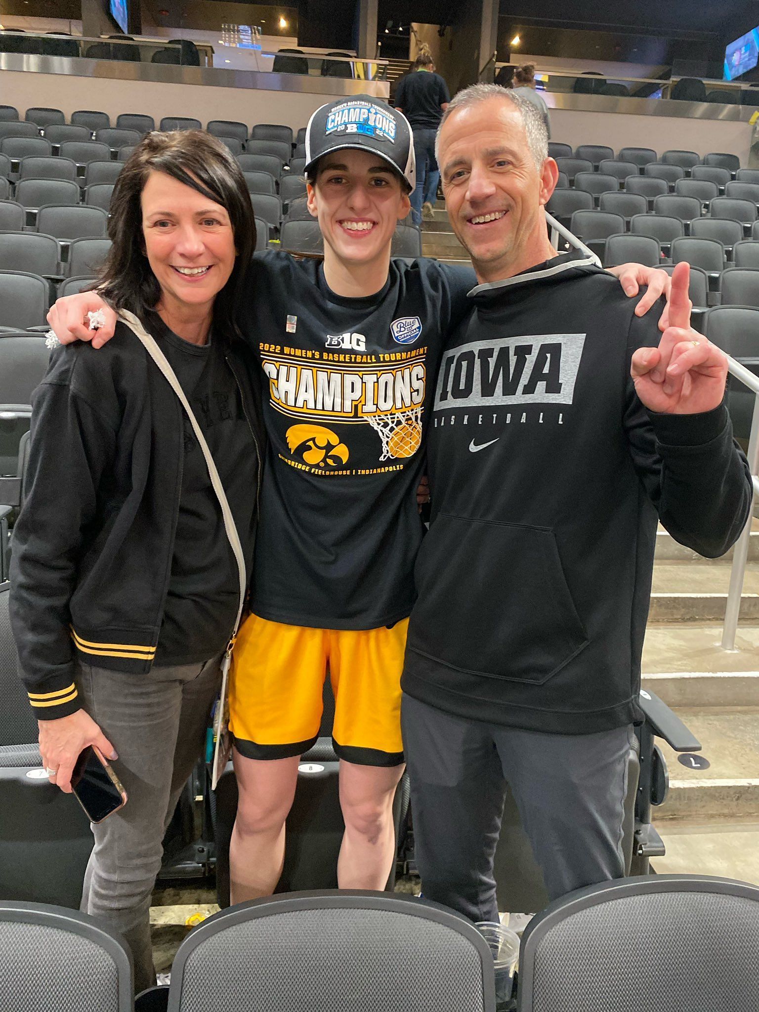 Caitlin Clark with her parents