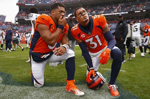 Russell Wilson and Justin Simmons at Las Vegas Raiders v Denver Broncos