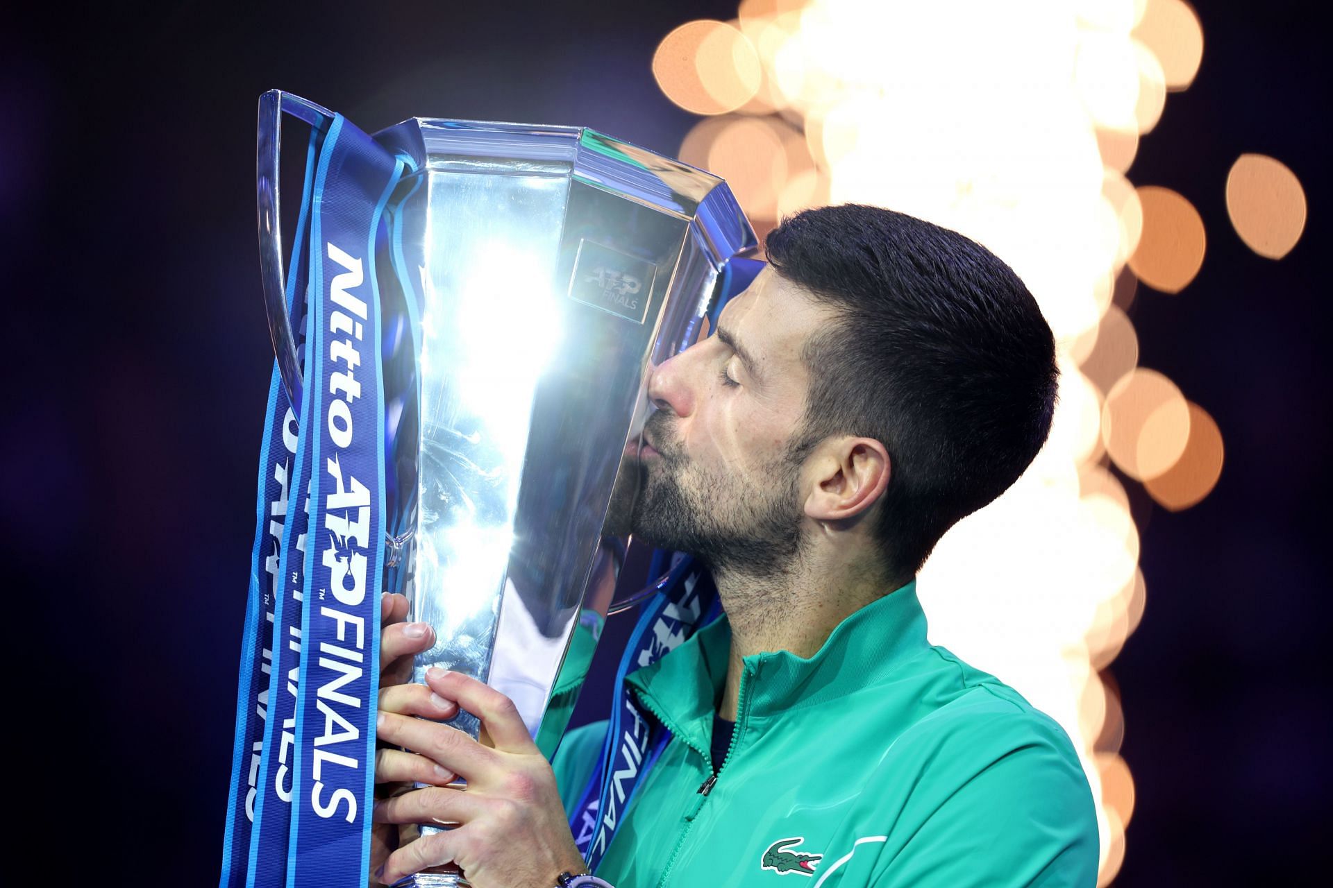 Novak Djokovic celebrating with the 2023 ATP Finals trophy