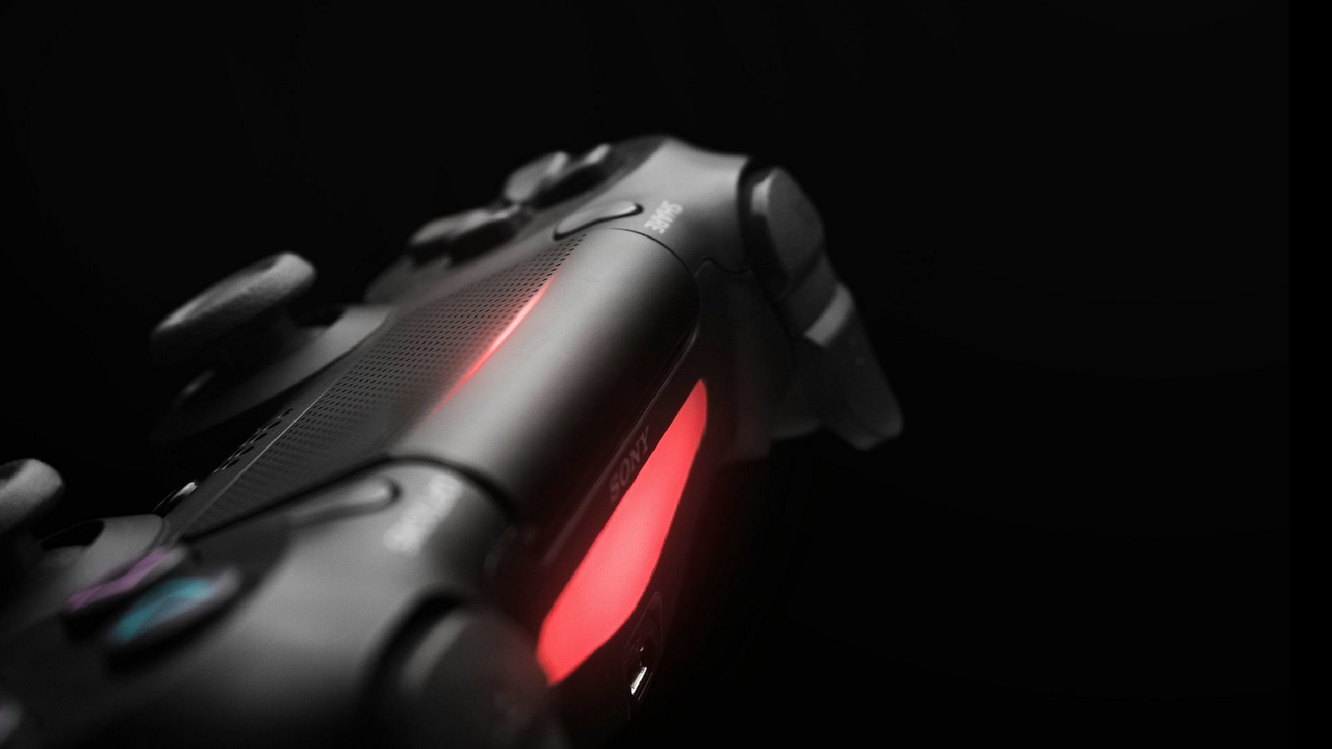 PS4 controller blinking red in the light bar (Image via Fabian Albert/Unsplash)