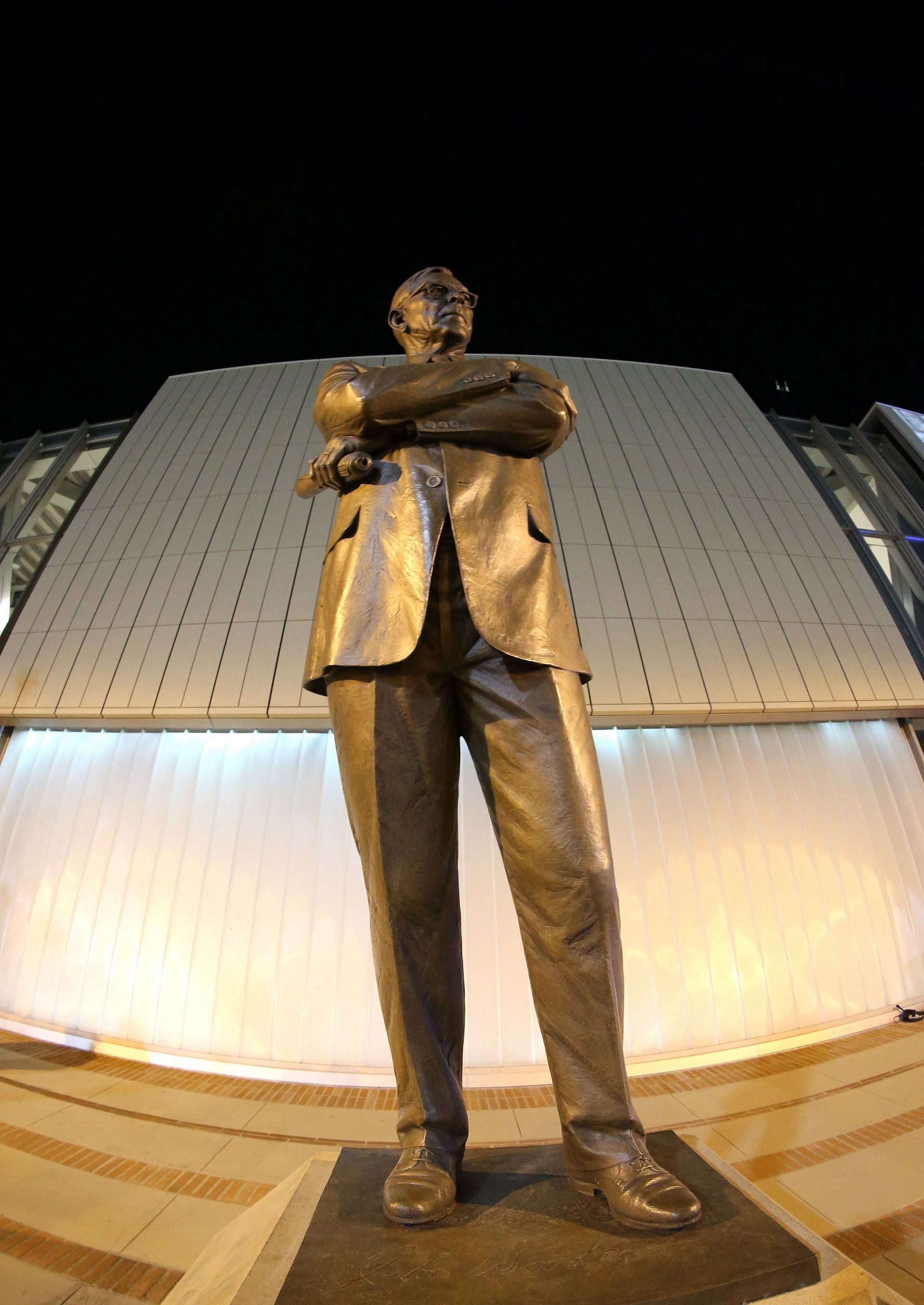 An erected statue of late UCLA coach John Wooden stands in front of Pauley Pavillion in Los Angeles