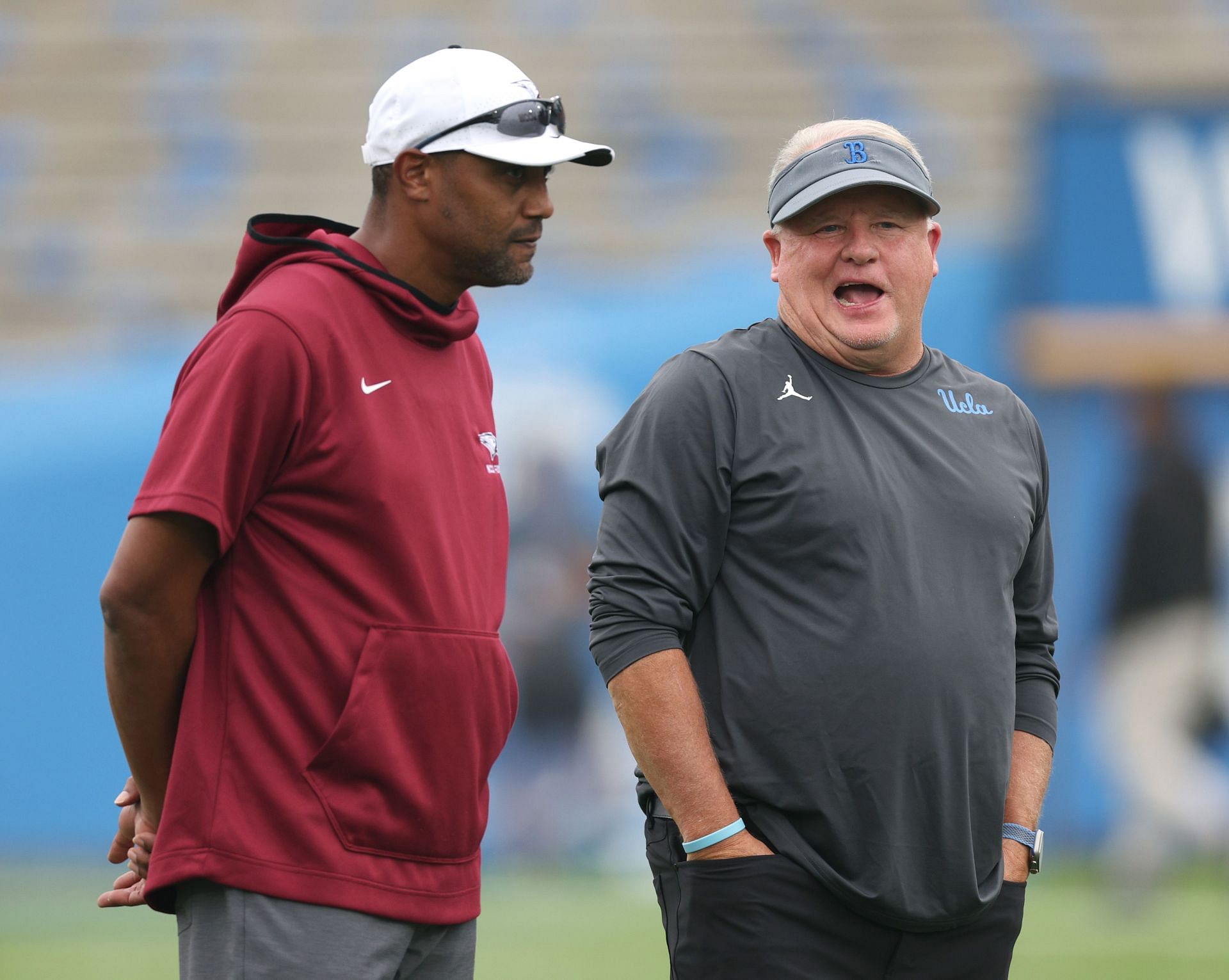 Former head coach Chip Kelly of the UCLA Bruins and head coach Trei Oliver of the North Carolina Central Eagles.