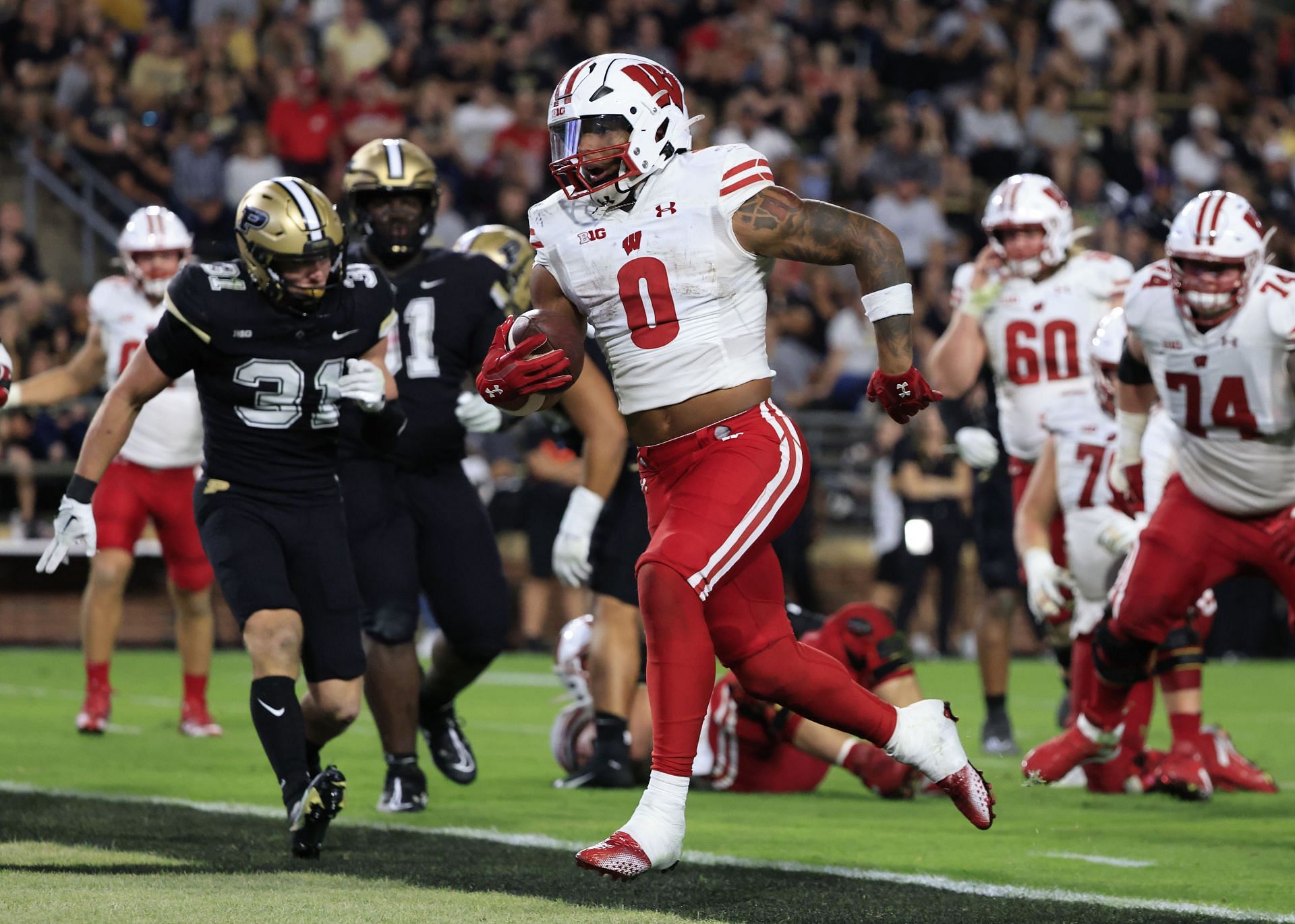 Braelon Allen #0 of the Wisconsin Badgers runs the ball for a touchdown during the second half in the game against the Purdue Boilermakers