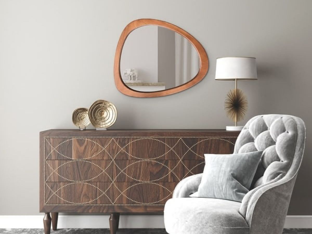 Pine asymmetrical wall mirror (Image via Bed Bath and Beyond)