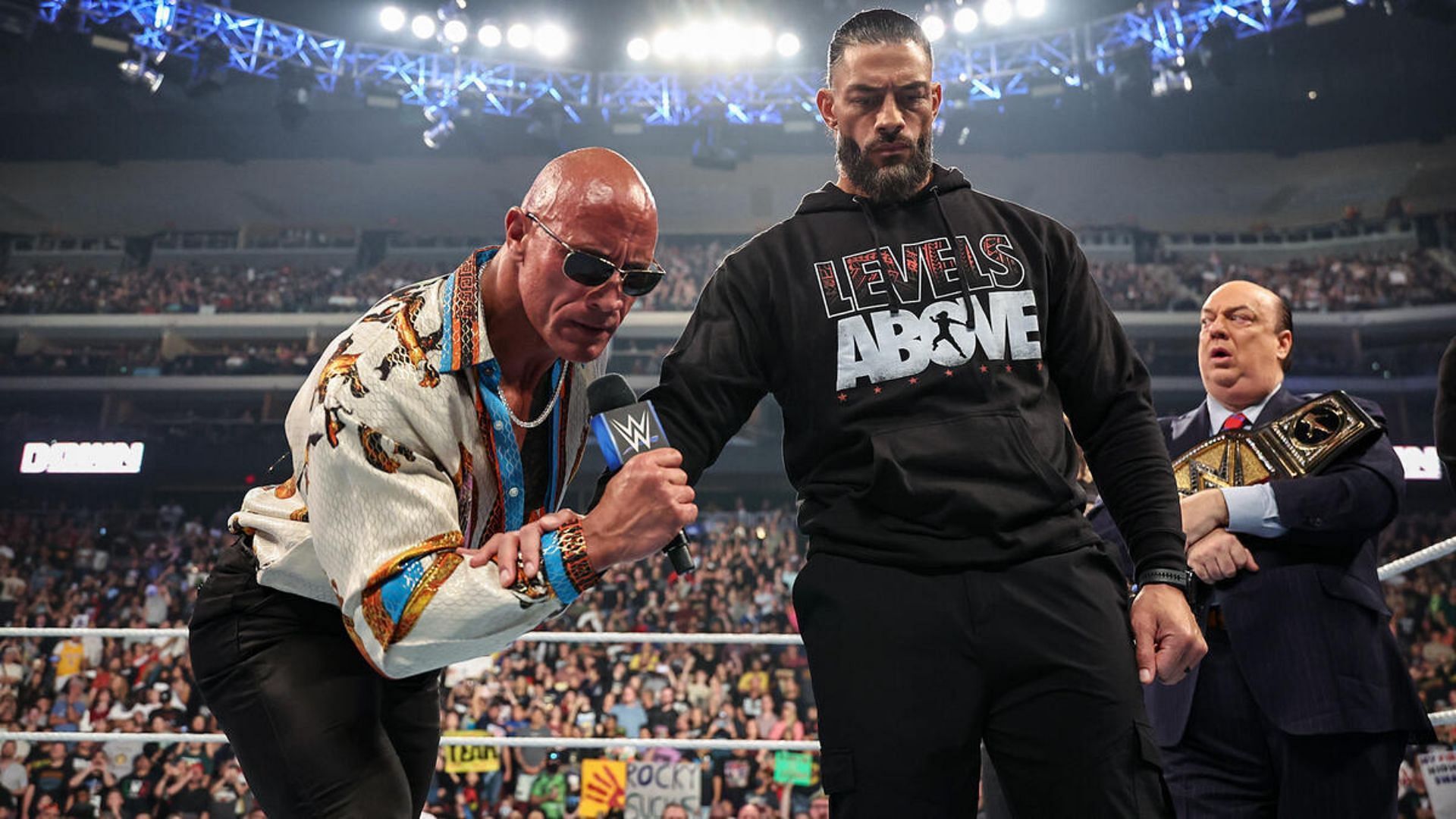 The Rock, Roman Reigns, and Paul Heyman are in The Bloodline
