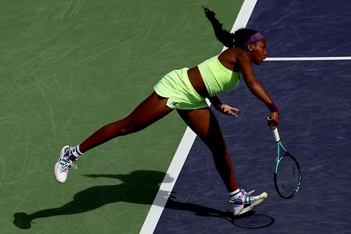 Coco Gauff serves during a point at the BNP Paribas Open 2024