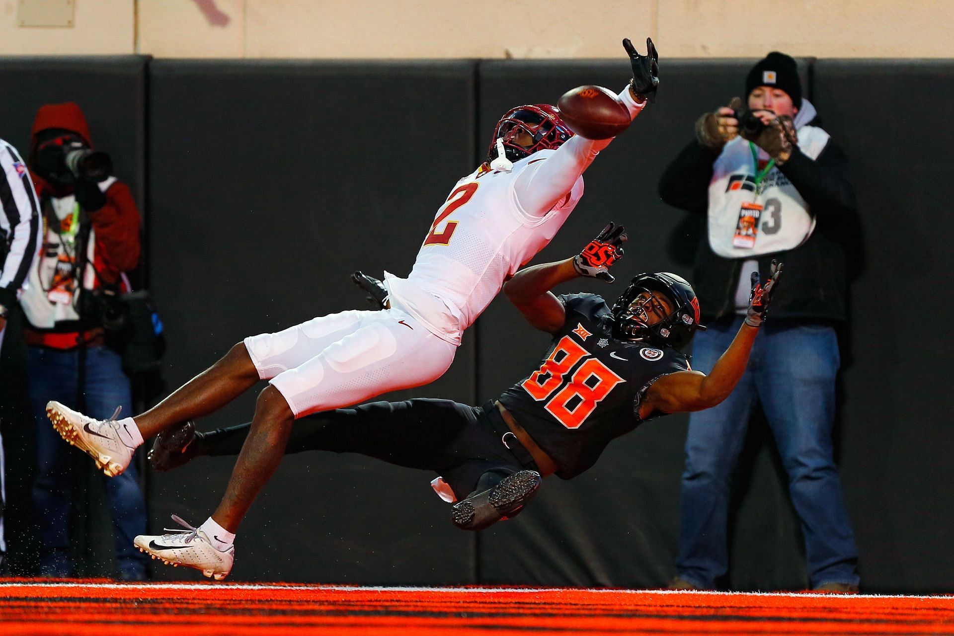 T.J. Tampa #2 of the Iowa State Cyclones blocks a touchdown pass as wide receiver Langston Anderson #88 of the Oklahoma State Cowboys