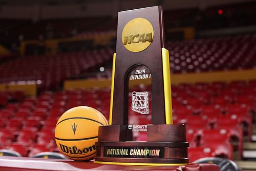 The NCAA men's basketball championship trophy is displayed before the game between the Arizona State Sun Devils and the USC Trojans at Desert Financial Arena on January 20, 2024, in Tempe, Arizona.